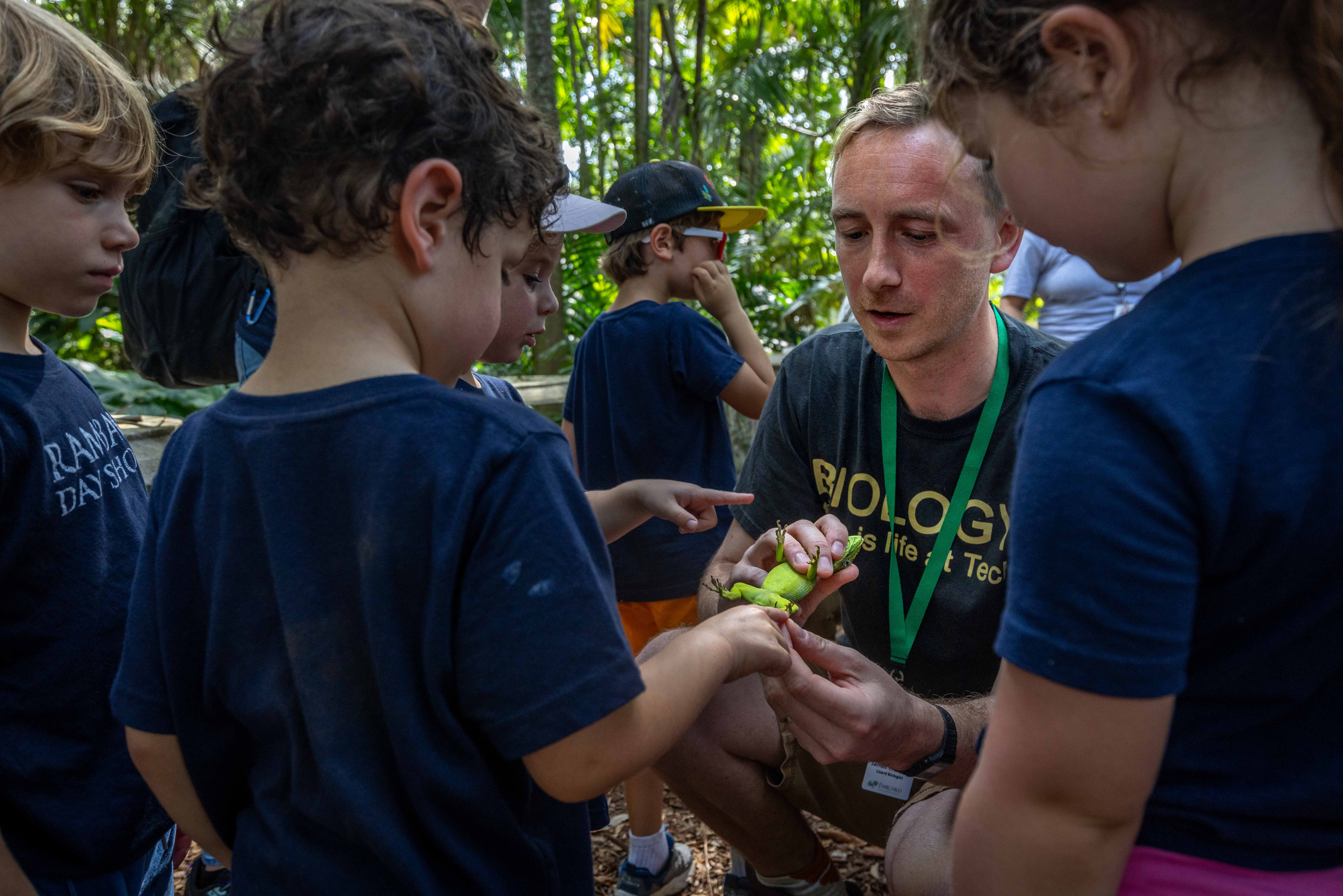 James Stroud showing a lizard to elementary school children in Miami, Florida